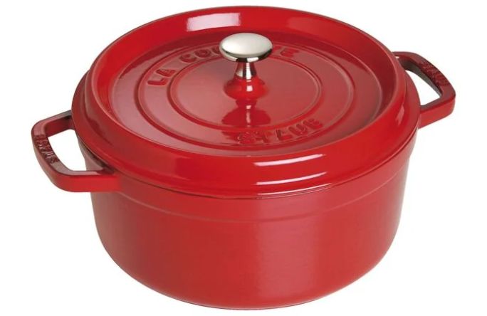 A vibrant red cast iron Dutch oven with a matching lid and a silver knob on top.